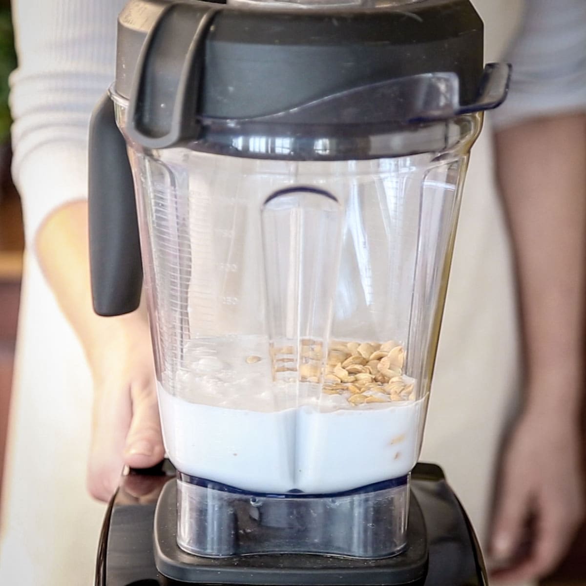 the coconut milk and peanuts in the blender