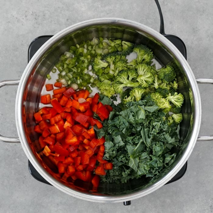 place veggies in a saucepan to steam them