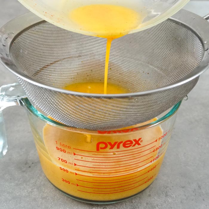 run eggs through a sieve to break them up
