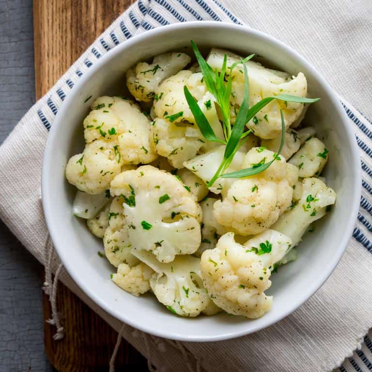 Simple Steamed Cauliflower with Herbs on Healthy Seasonal Recipes. Only 45 calories per serving. Low-carb and gluten-free #lowcarb #glutenfree #keto #cauliflower #sidedish #lowcalorie