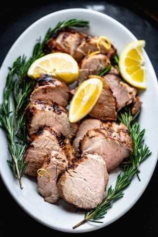 Grilled Pork Tenderloin on a white platter