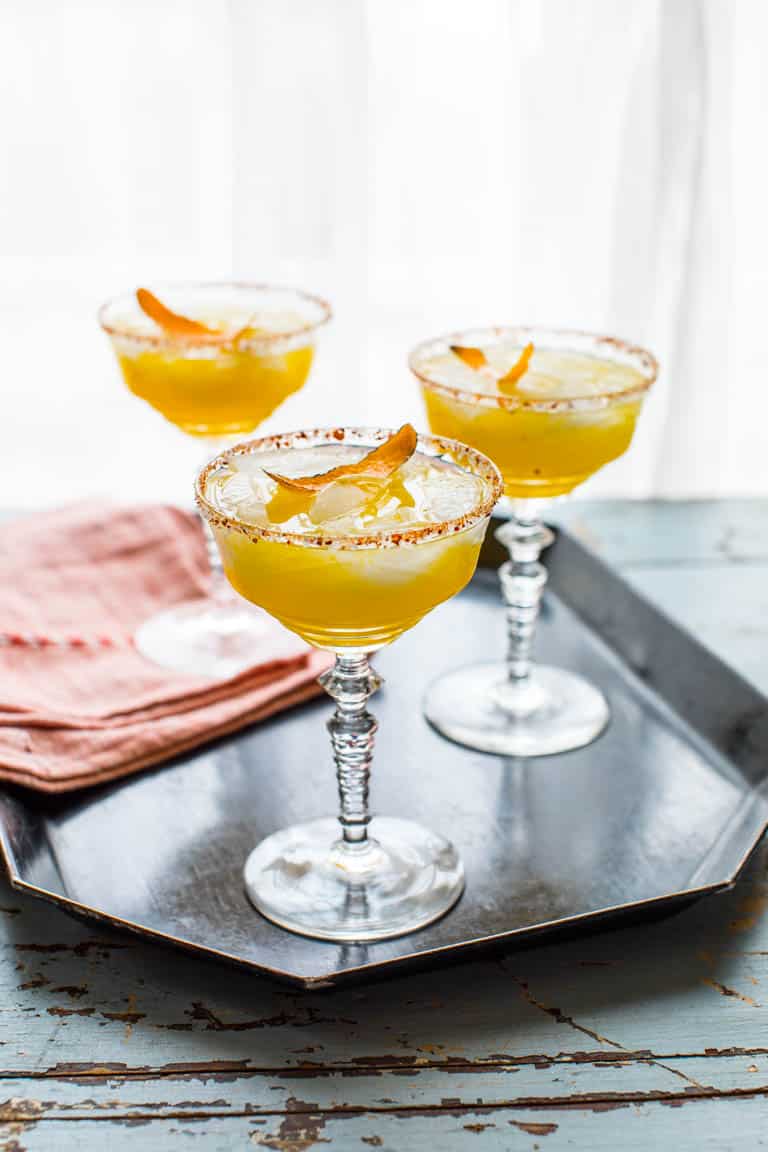 Three Smoky Mescal Margaritas on a tray with a red linen