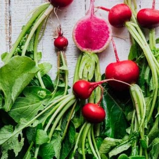 The Ultimate Guide to Radishes, part of my Produce Spotlight Series on Healthy Seasonal Recipes. Your questions about if it okay to eat radishes on the keto diet. Can I cook radishes and can you eat radish greens. By Katie Webster. #radishes