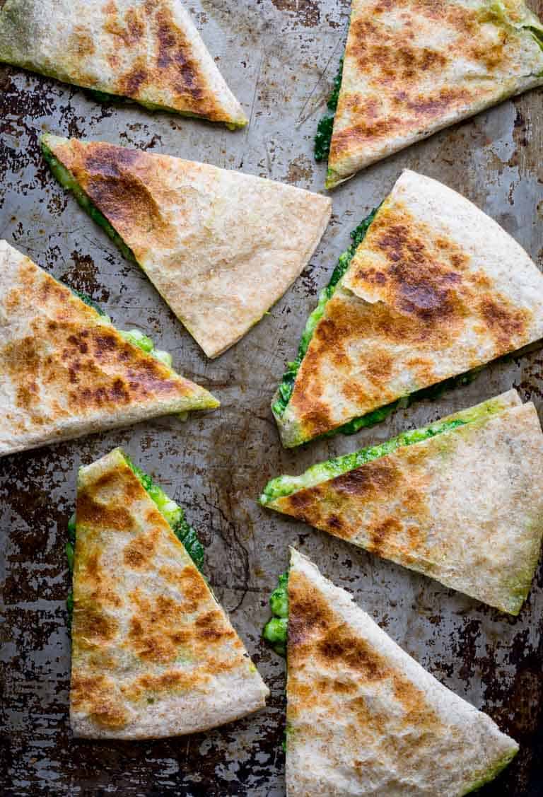 Cheese and Spinach Quesadilla wedges a baking sheet.