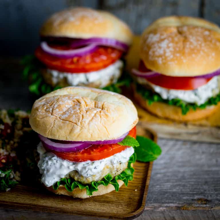 Burgers made from ground chicken, seasoned with za’atar and topped with cucumber mint tzatziki
