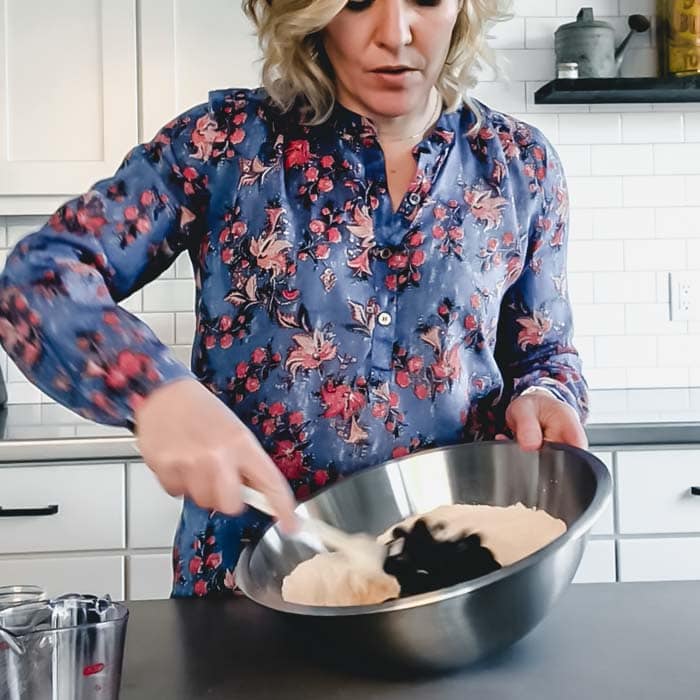 A woman preparing food in a kitchen