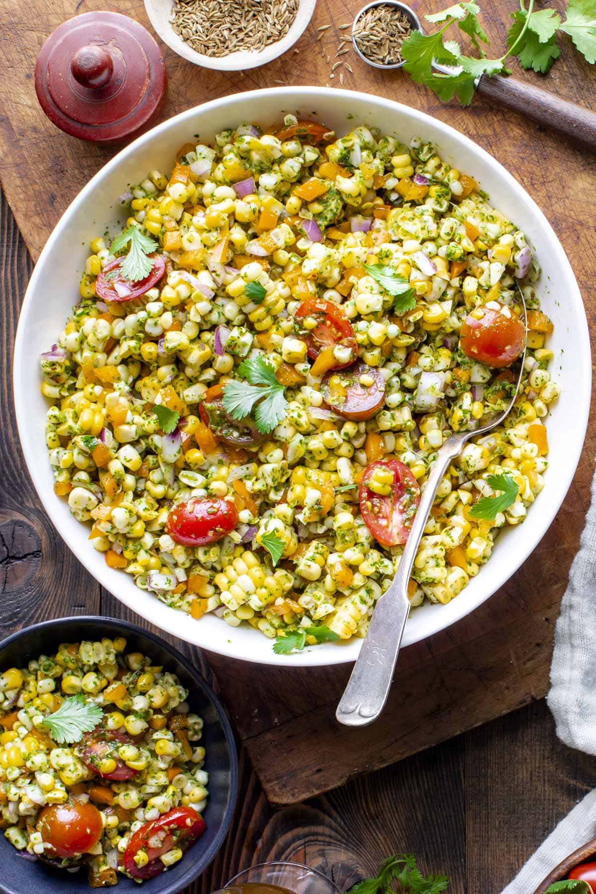 the Mexican corn salad mixed together in a white bowl