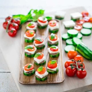 Cucumber Greek Salad Bites on a wooden platter