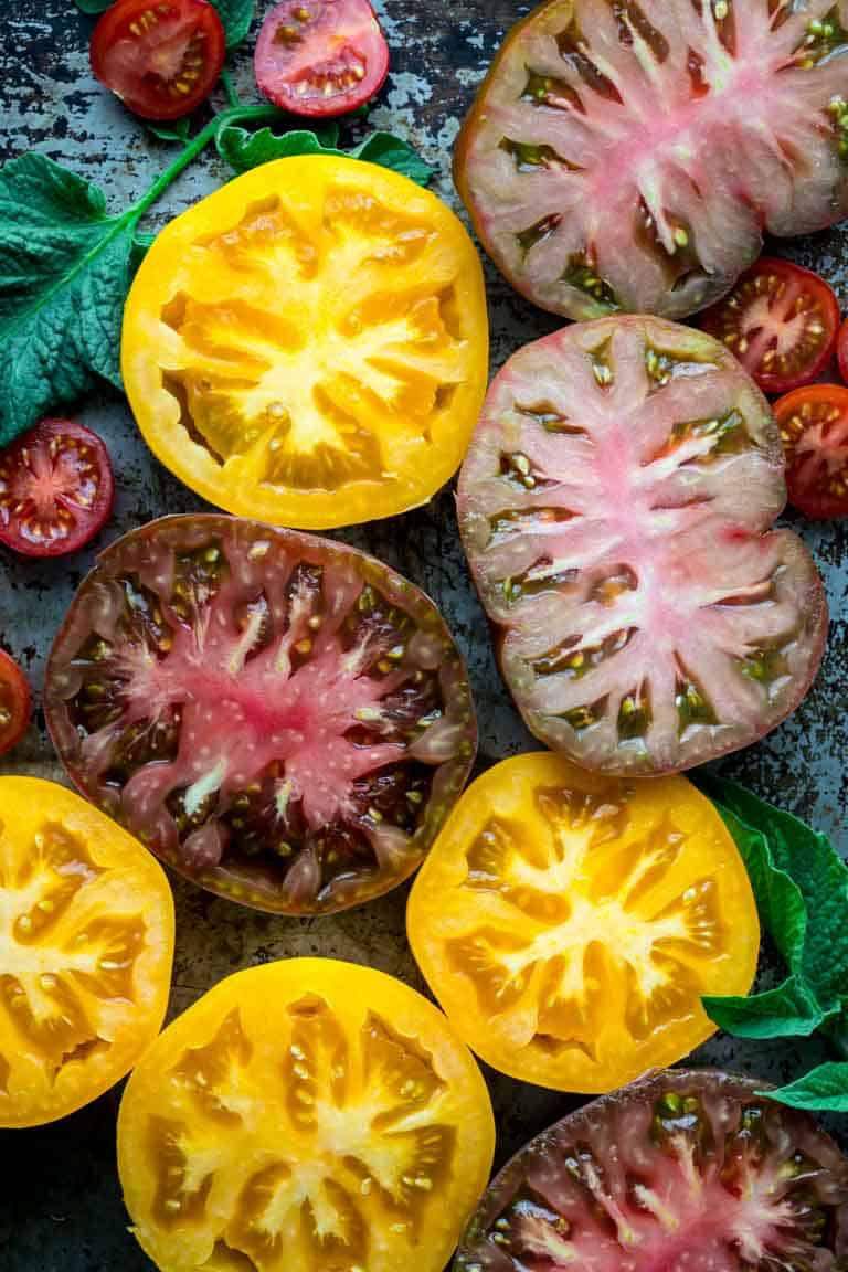 Sliced tomatoes layer alongside each other