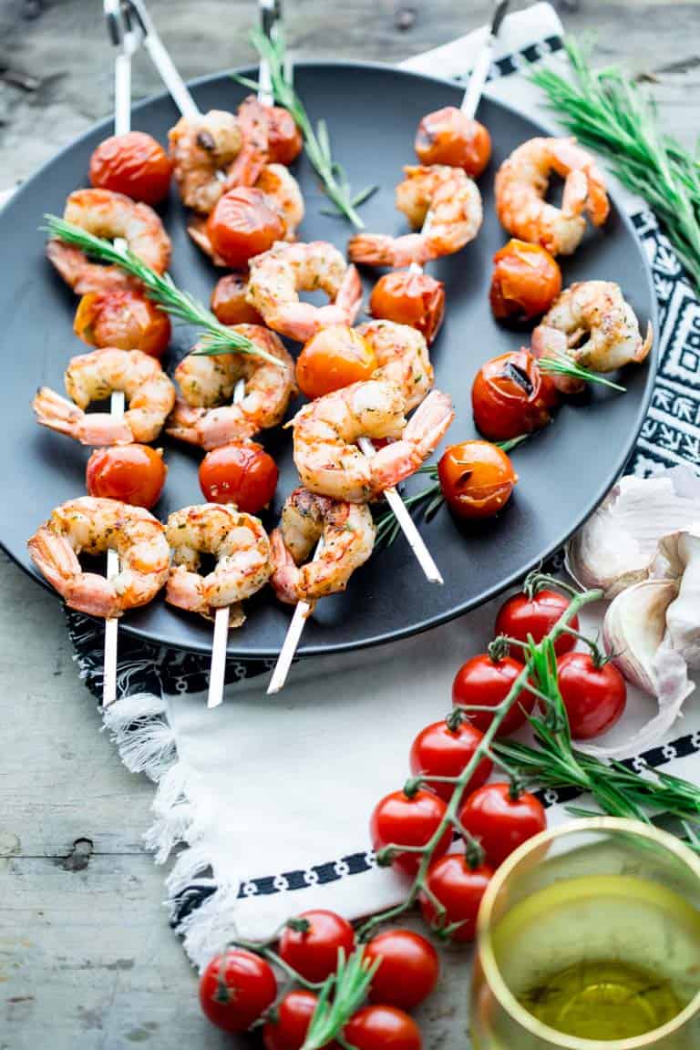 a platter of shrimp kebabs