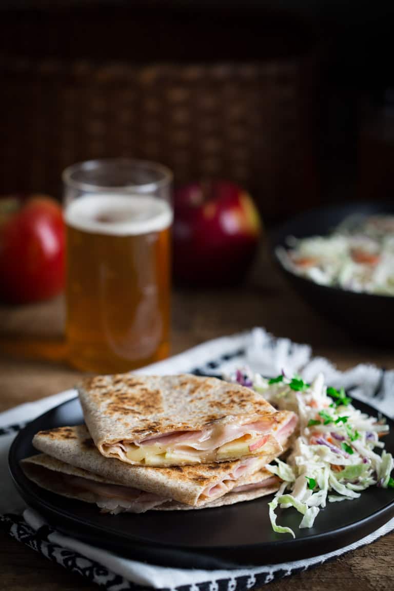 Apple Quesadilla on a plate with a side slaw