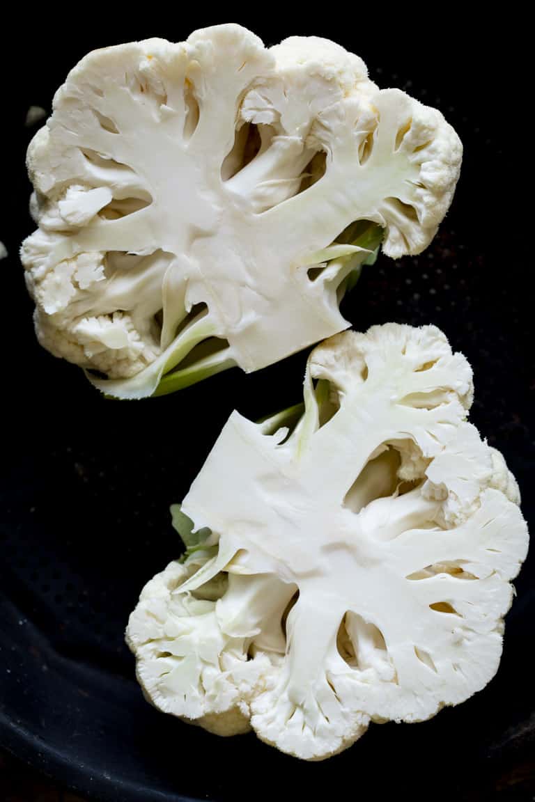 Ever wondered is you can regrow cauliflower? Are cauliflower stalks edible? How do you make cauliflower rice? Read up on cauliflower growing info, culinary tips and nutrition in this Ultimate Guide to Cauliflower. Healthy Seasonal Recipes by Katie Webster | #cauliflower #seasonal #produce #fresh #guide