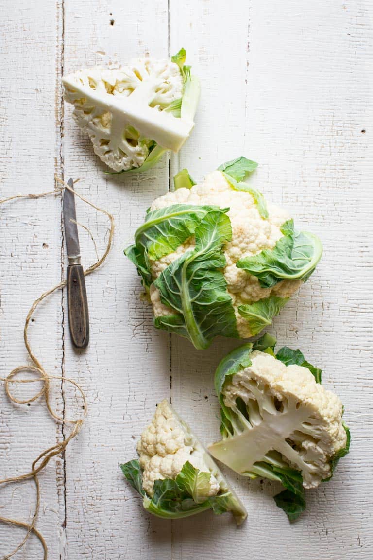 Ever wondered is you can regrow cauliflower? Are cauliflower stalks edible? How do you make cauliflower rice? Read up on cauliflower growing info, culinary tips and nutrition in this Ultimate Guide to Cauliflower. Healthy Seasonal Recipes by Katie Webster | #cauliflower #seasonal #produce #fresh #guide