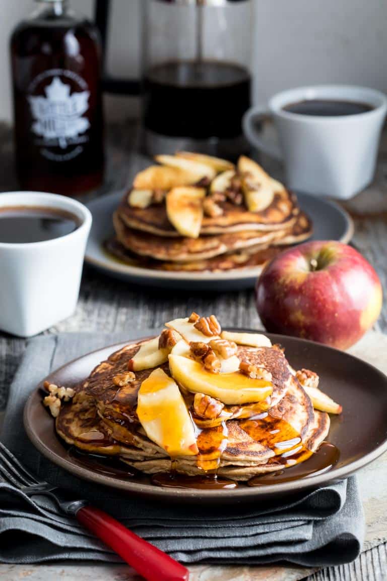 Behold, fall on a plate! These gluten-free Apple Protein Pancakes are going to be on your breakfast table for the entire fall season. Mark my words. They are made with oats, cottage cheese, eggs, and apples! You would never guess they don't have any flour in them! They're 106 calories each and have 7 grams protein each.