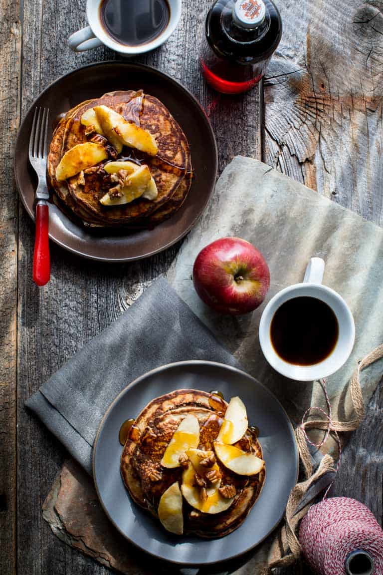 Behold, fall on a plate! These gluten-free Apple Protein Pancakes are going to be on your breakfast table for the entire fall season. Mark my words. They are made with oats, cottage cheese, eggs, and apples! You would never guess they don't have any flour in them! They're 106 calories each and have 7 grams protein each.
