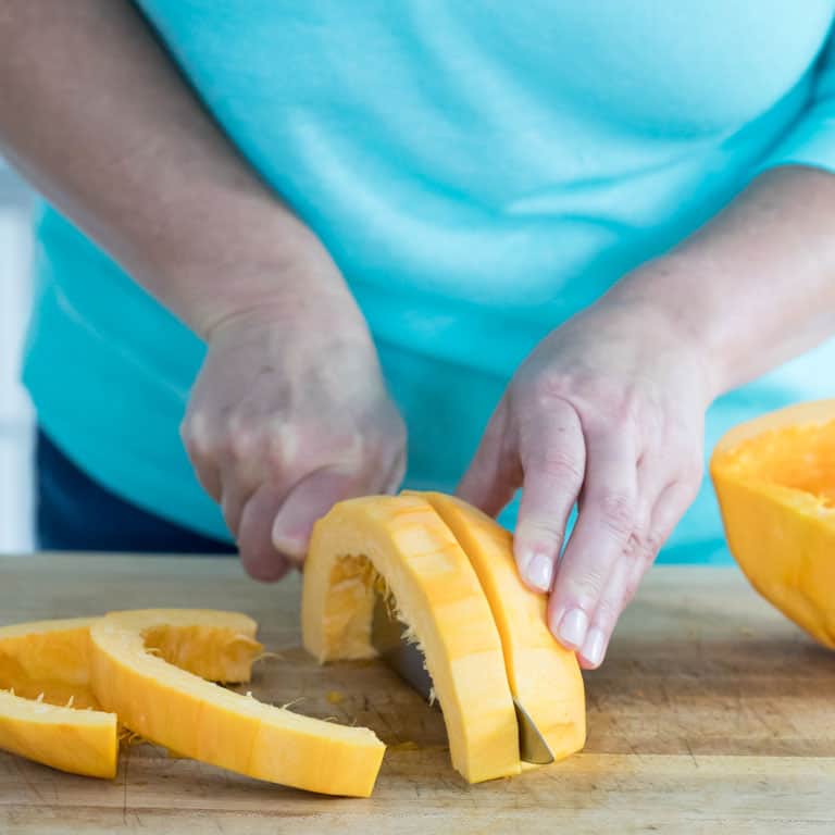 cut the seeded pumpkin into 1/2 to 1-inch thick wide strips.