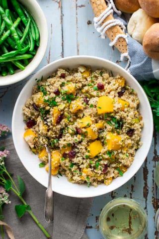 Please tell me you won't wait until Thanksgiving to try this Vegetarian Thanksgiving Pilaf with Pumpkin and Quinoa! It is too good to wait, and now that fresh pie pumpkins are in season, I highly recommend that you make it for dinner or serve it as a side dish. Seriously, don't wait. It's made with dried cranberries, leek and orange zest and it's naturally vegan and gluten-free so all the people will love it! #vegetarian #thanksgiving #pumpkin #quinoa #vegan #glutenfree #healthy #sidedish #onepot #stovetop #pilaf #healthyseasonal