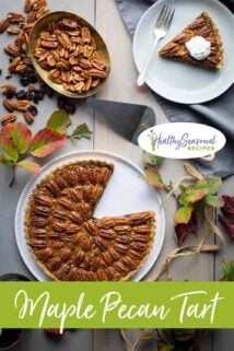 pecan tart on a table with nuts and leaves