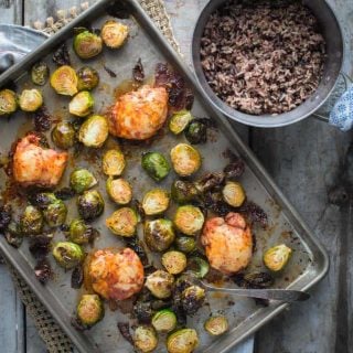 Chicken and Brussels Sprouts Sheet Pan DInner on a sheet pan and also a pot of rice from overhead