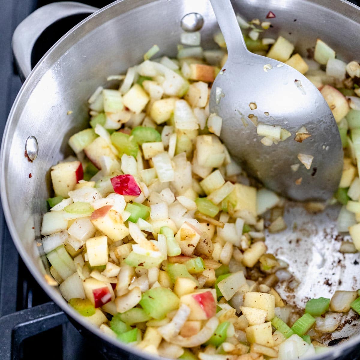 Apples, celery onion and garlic cooking for Mussels recipe.