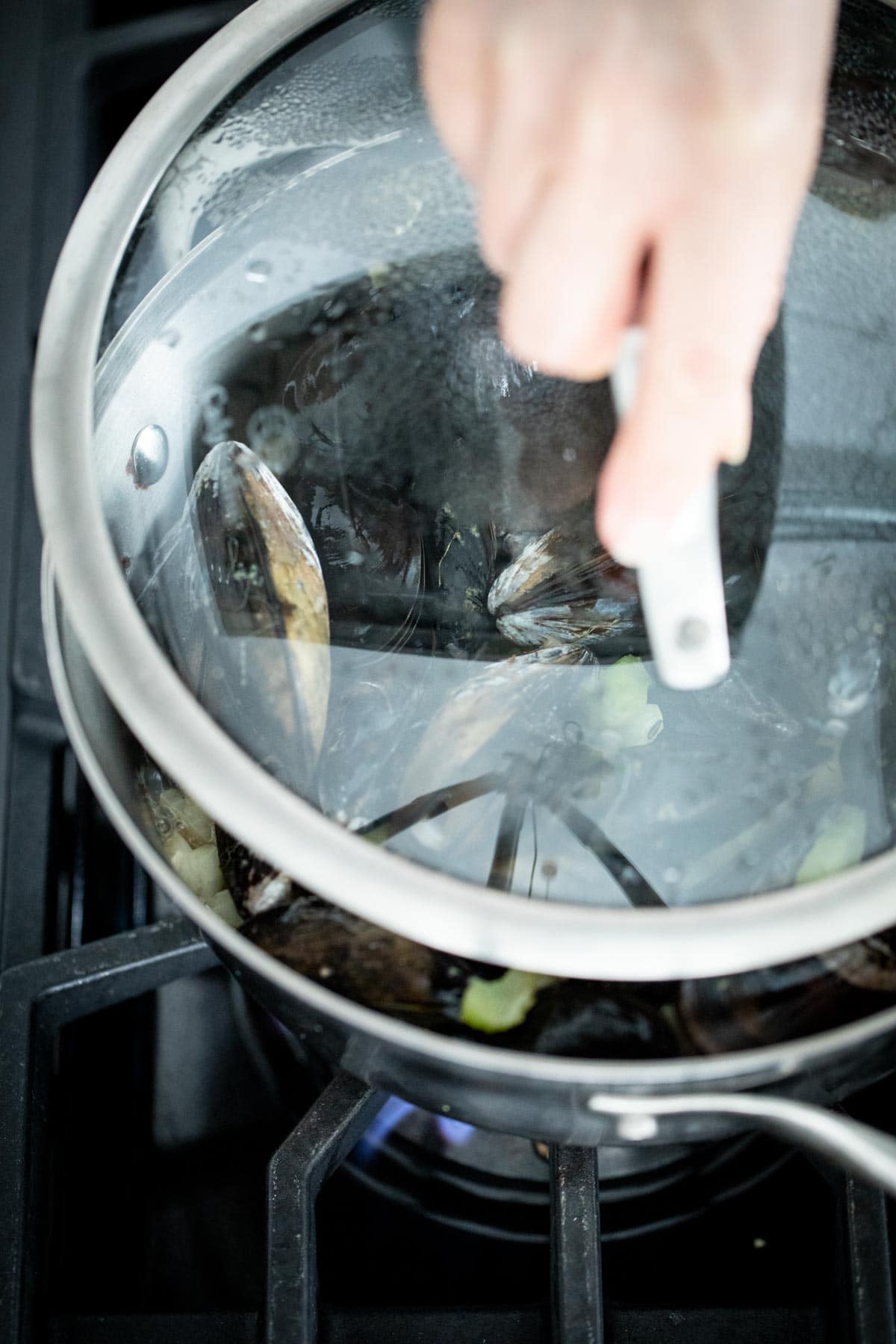 Cover the mussels to let them steam