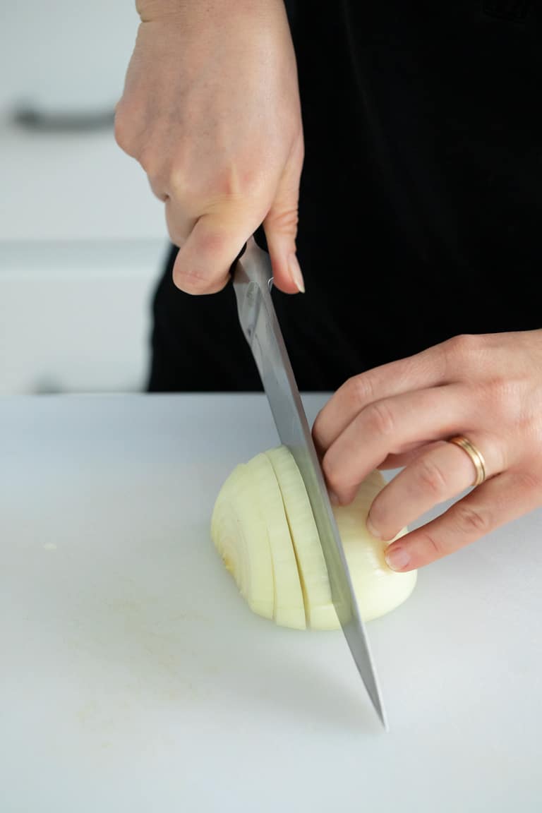 How to Philly Cut an onion, a less refined way to slice an onion for quicker cooking, rustic recipes and when you want the onion to break down as it caramelizes.