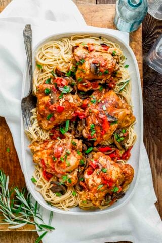 the platter with spaghetti and the cacciatore on top