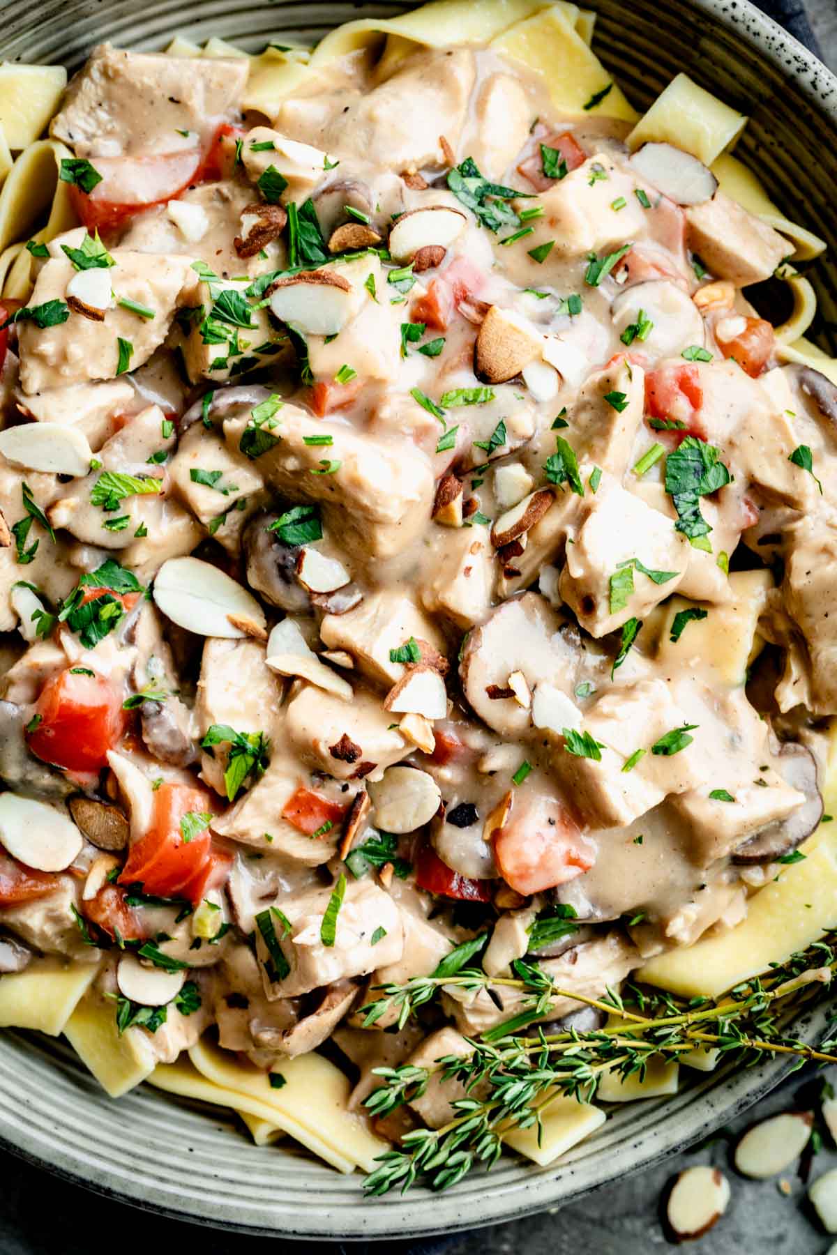 close-up of chicken a la king over noodles