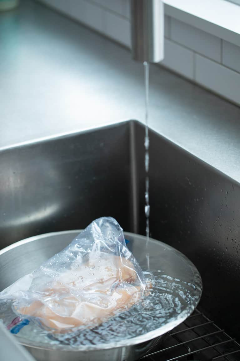 how to thaw chicken in water