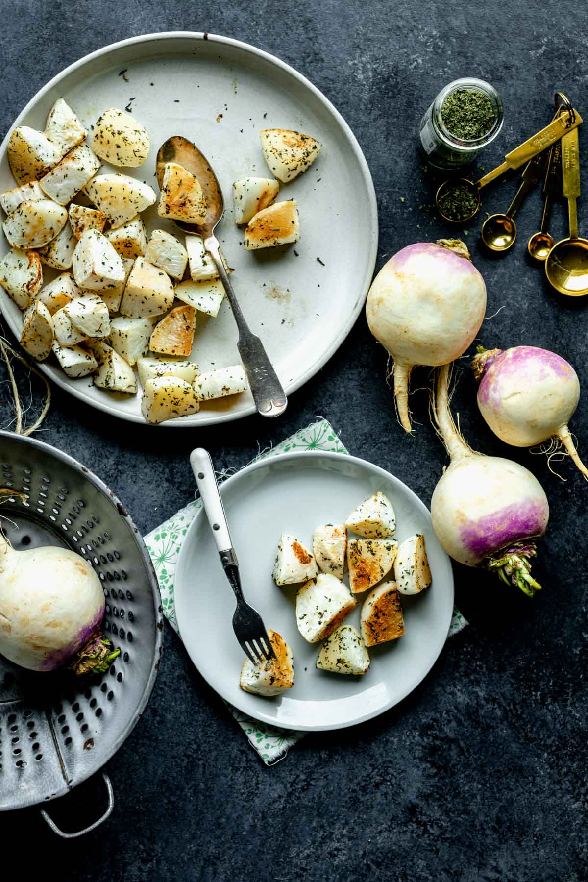 the turnips, and seasonings on a dark tabletop