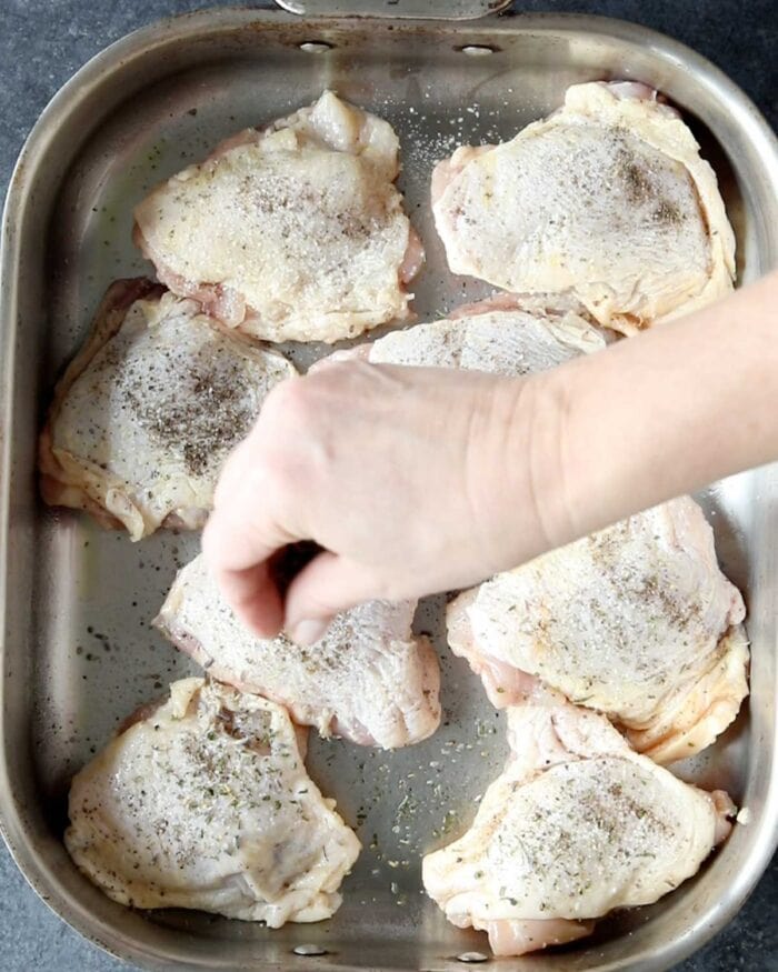 season the chicken thighs with salt and seasoning blend