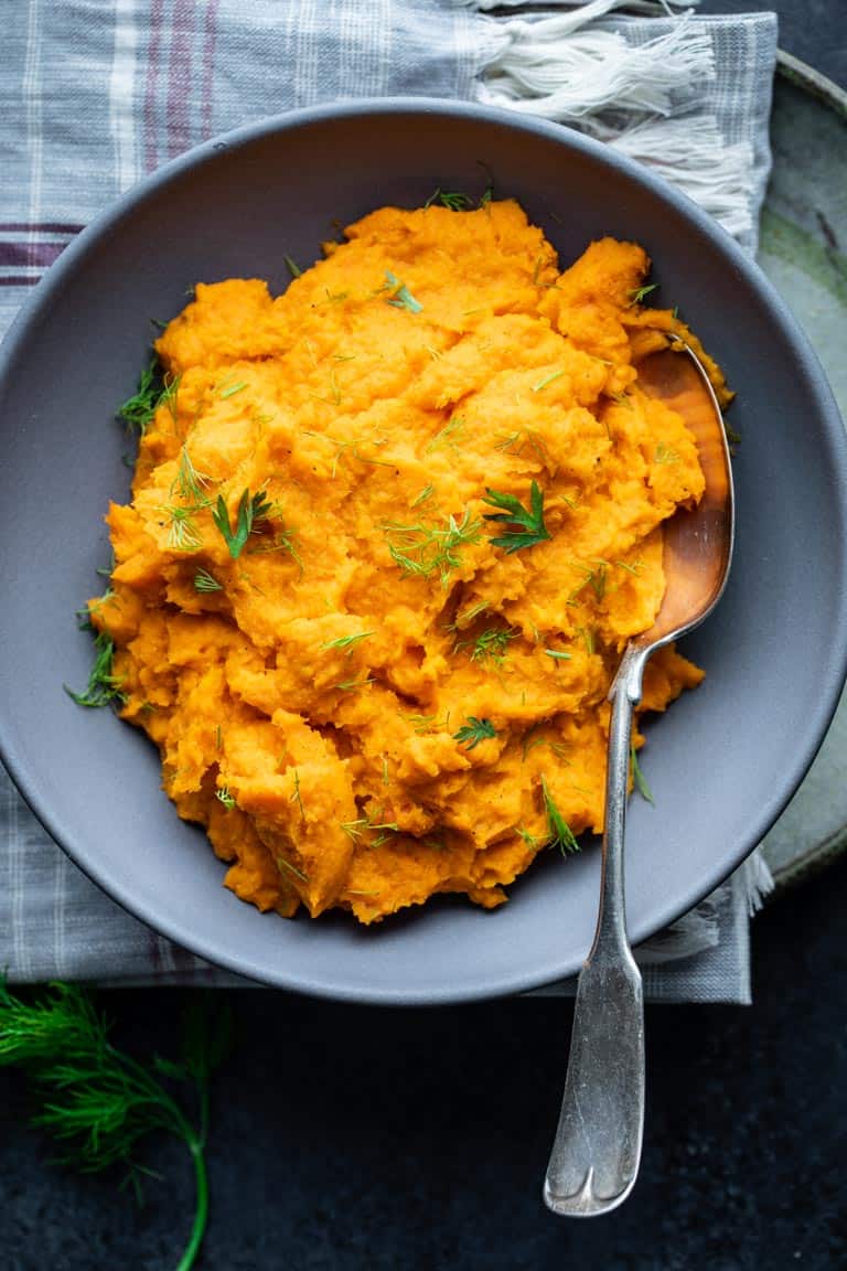 Mashed Carrots and Parsnips in a Gray Bowl.