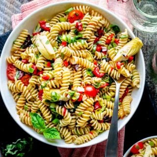 the pasta salad in a white bowl from overhead closeup