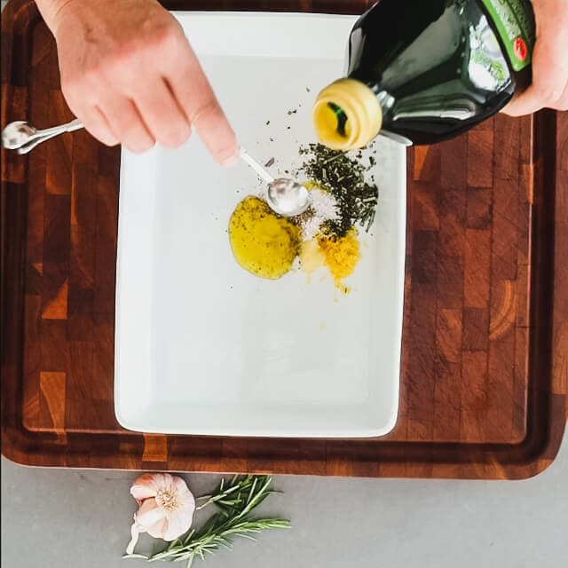Combine oil, salt, pepper, rosemary and lemon zest in a shallow dish