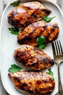 a gray platter with four pieces of chicken
