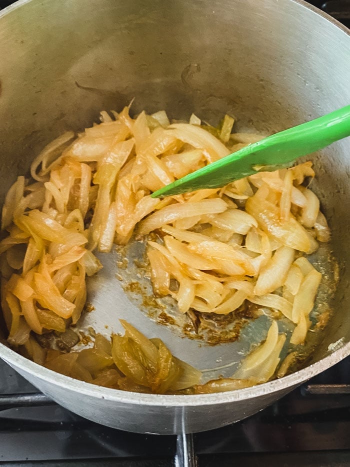 stirring the fond into the onions