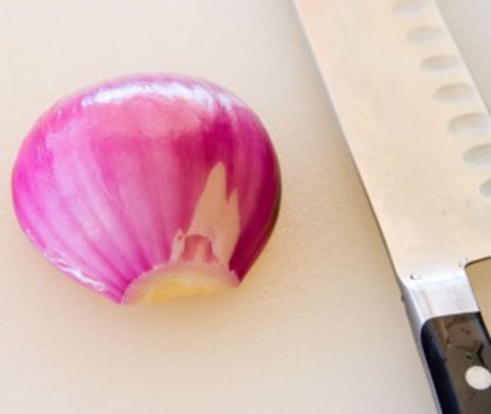half an onion on work surface.