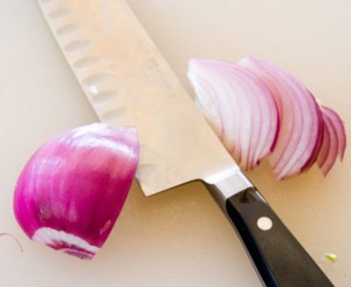 Slice onion halves from root end to stem end