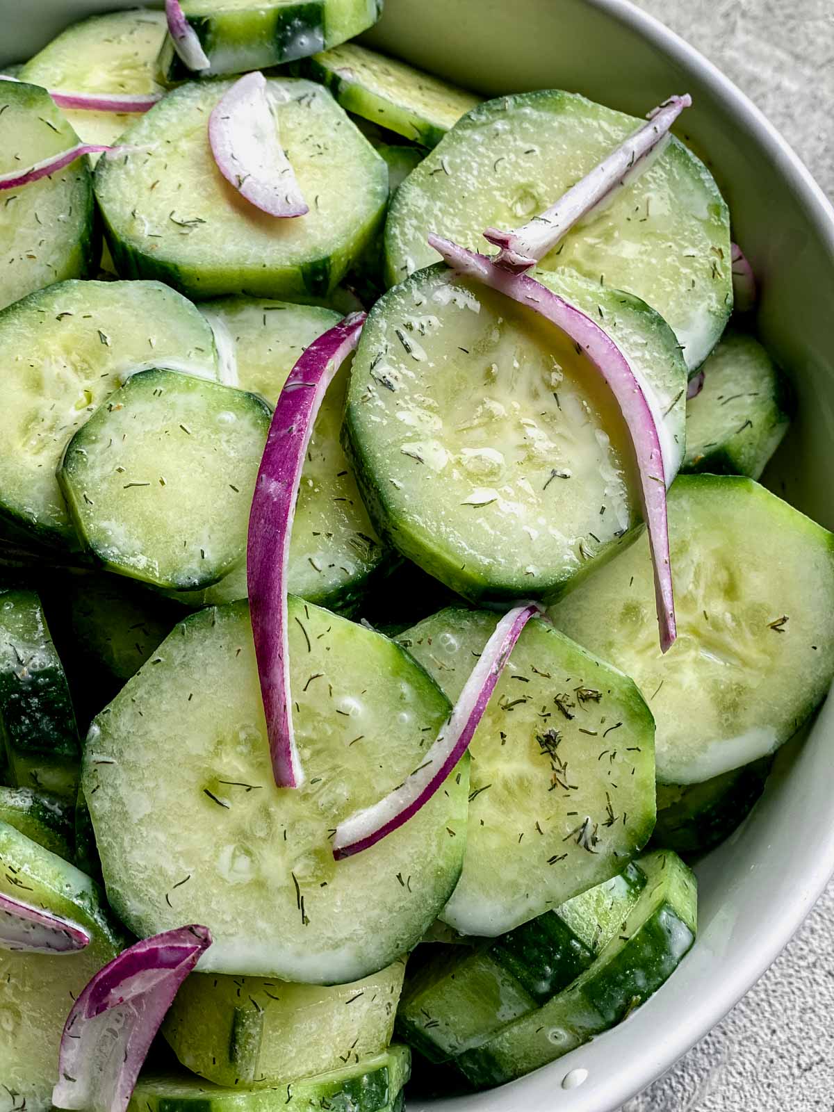 closeup of the cucumber salad with yogurt and red onion