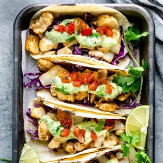 several tacos on a tray