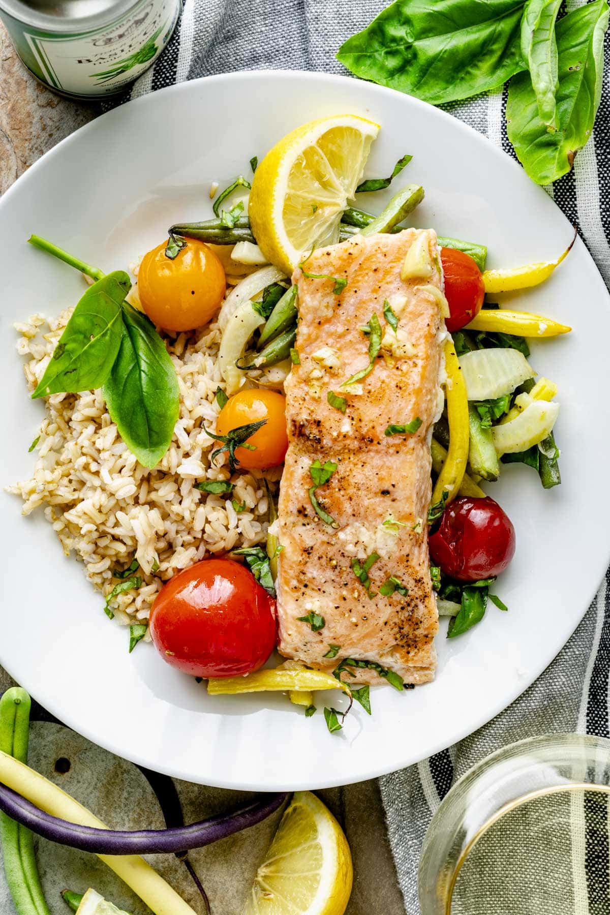 a portion of the salmon dinner on a white dinner plate