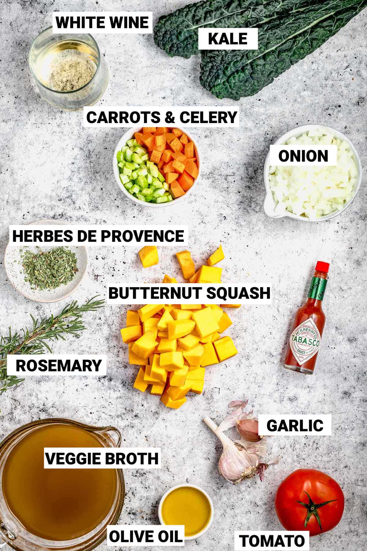 the soup ingredients laid out on a gray countertop with text labels