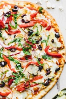 A pizza sitting on top of a cutting board