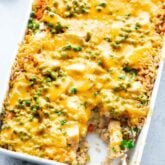 overhead of casserole with a scoop taken out