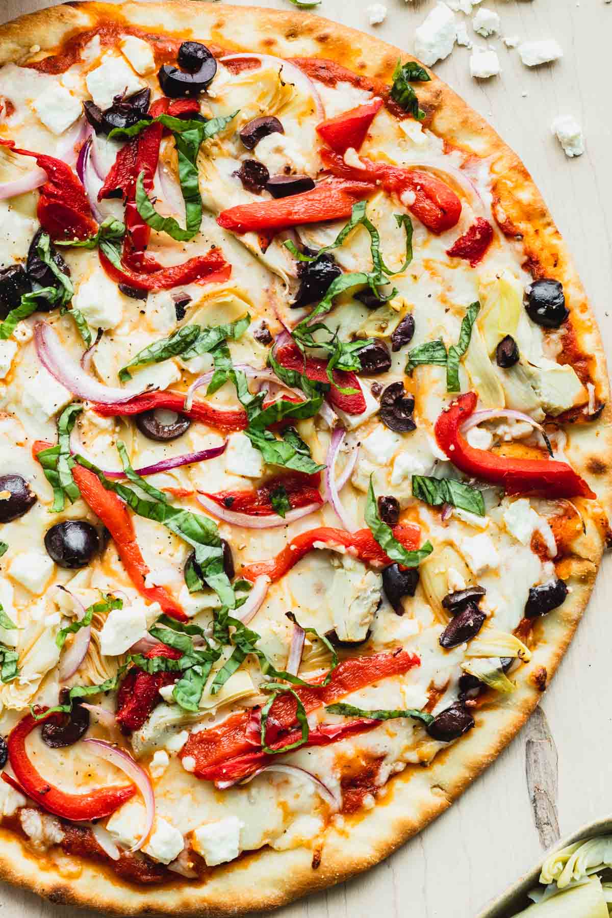 Close up of pizza sitting on top of a cutting board