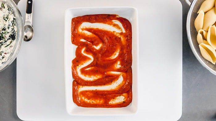 sauce in the bottom of the casserole dish