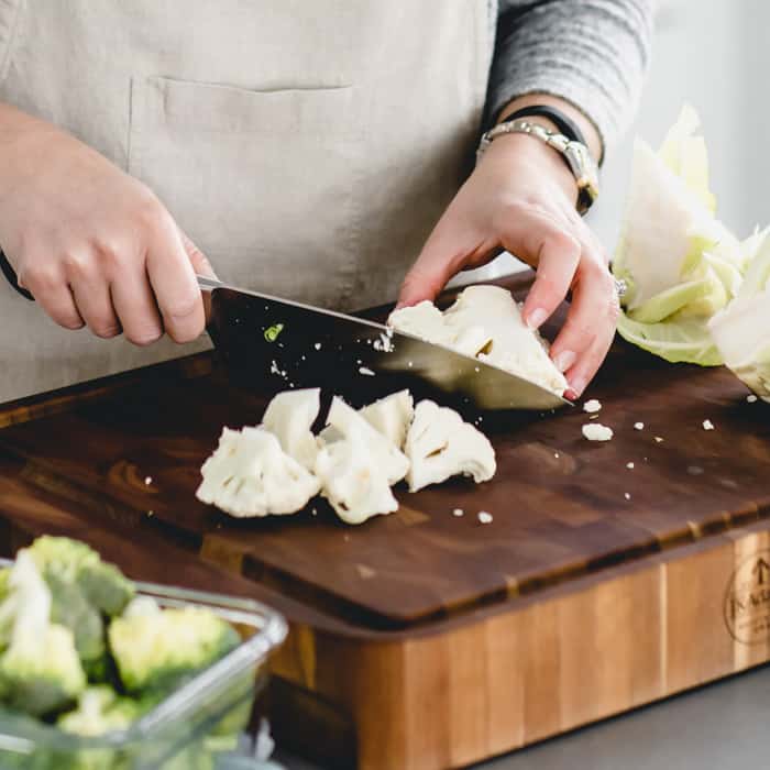 chopping broccoli and cauliflower