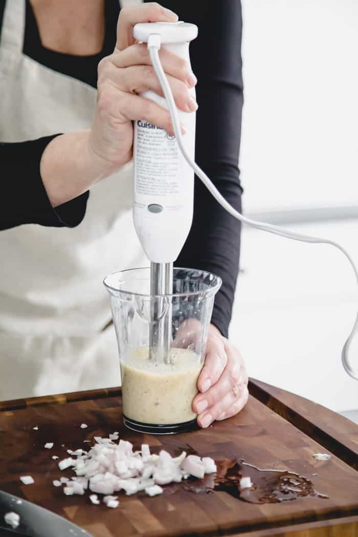 lemon juice salad dressing prep with immersion blender