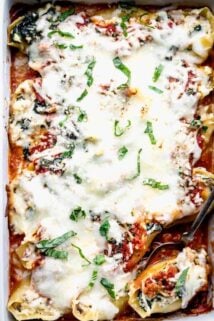 A close up overhead view inside a baking dish with stuffed shells