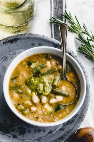 Soupe au pistou from overhead in a white bowl on a gray pie plate
